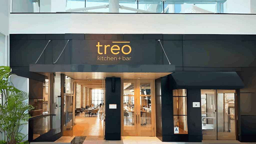 Professional installer completing corporate signage installation on a modern office building exterior for All Star Signs