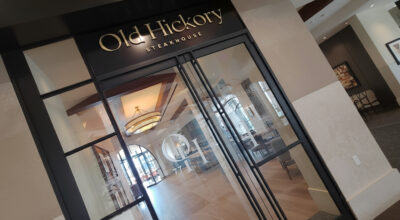 Dimensional letter signage installed at a restaurant entrance, demonstrating premium raised lettering used in professional business signage.