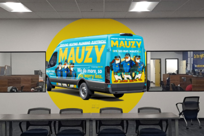 Custom office wall graphic featuring a large MAUZY service van wrap illustration on a conference room wall.