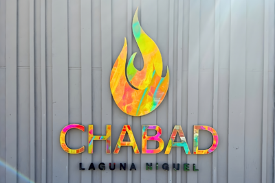 Colorful dimensional Chabad Laguna Niguel exterior signage mounted on modern building facade