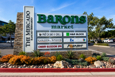 Modern multi-tenant monument sign at a San Diego shopping center showcasing professionally installed exterior business signage that complies with local permitting requirements.