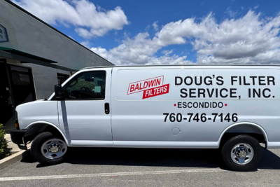 White commercial service van with professionally installed vinyl vehicle graphics for Doug's Filter Service in San Diego County, showcasing clean fleet branding by All Star Signs.