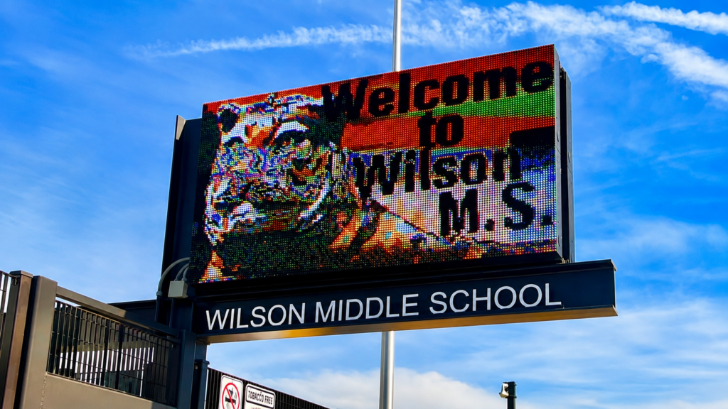 Digital school marquee sign at Wilson Middle School displaying a welcome message in San Diego County