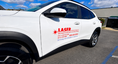Vehicle graphics in San Diego featuring branded business lettering on a white company vehicle